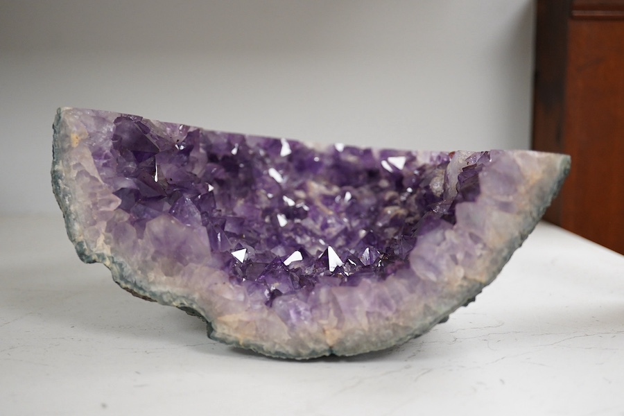 An amethyst geode specimen, 21.5cm high, 20.5cm wide at the base. Condition - fair to good.